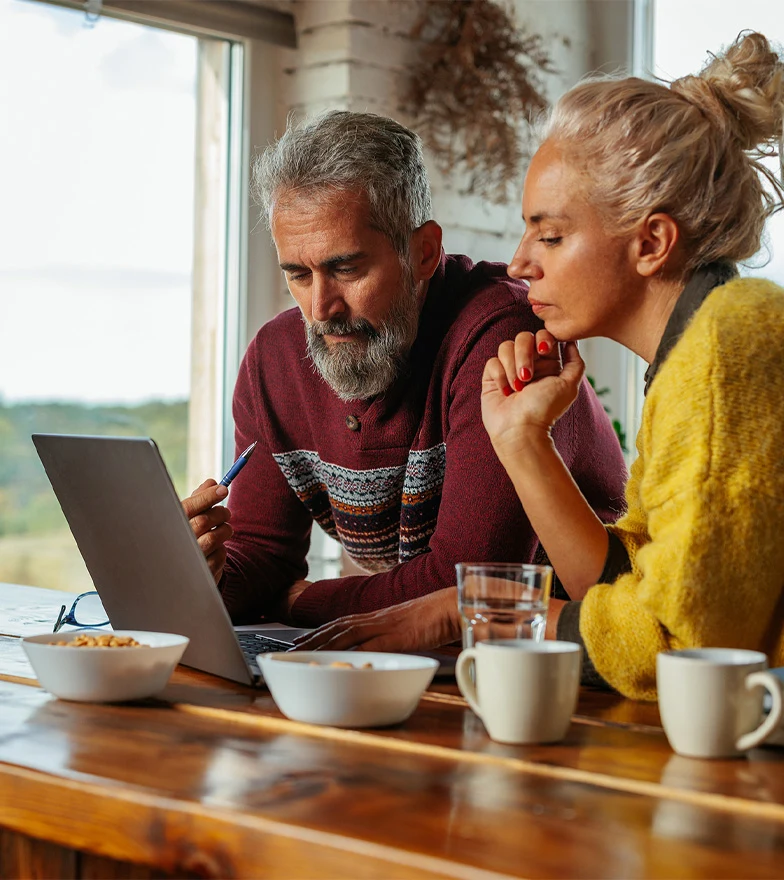 Couple looking at laptop screen