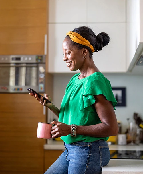 Woman on phone in kitchen