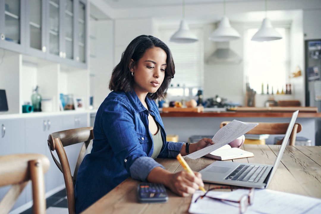 Woman going through paperwork and savings.jpg