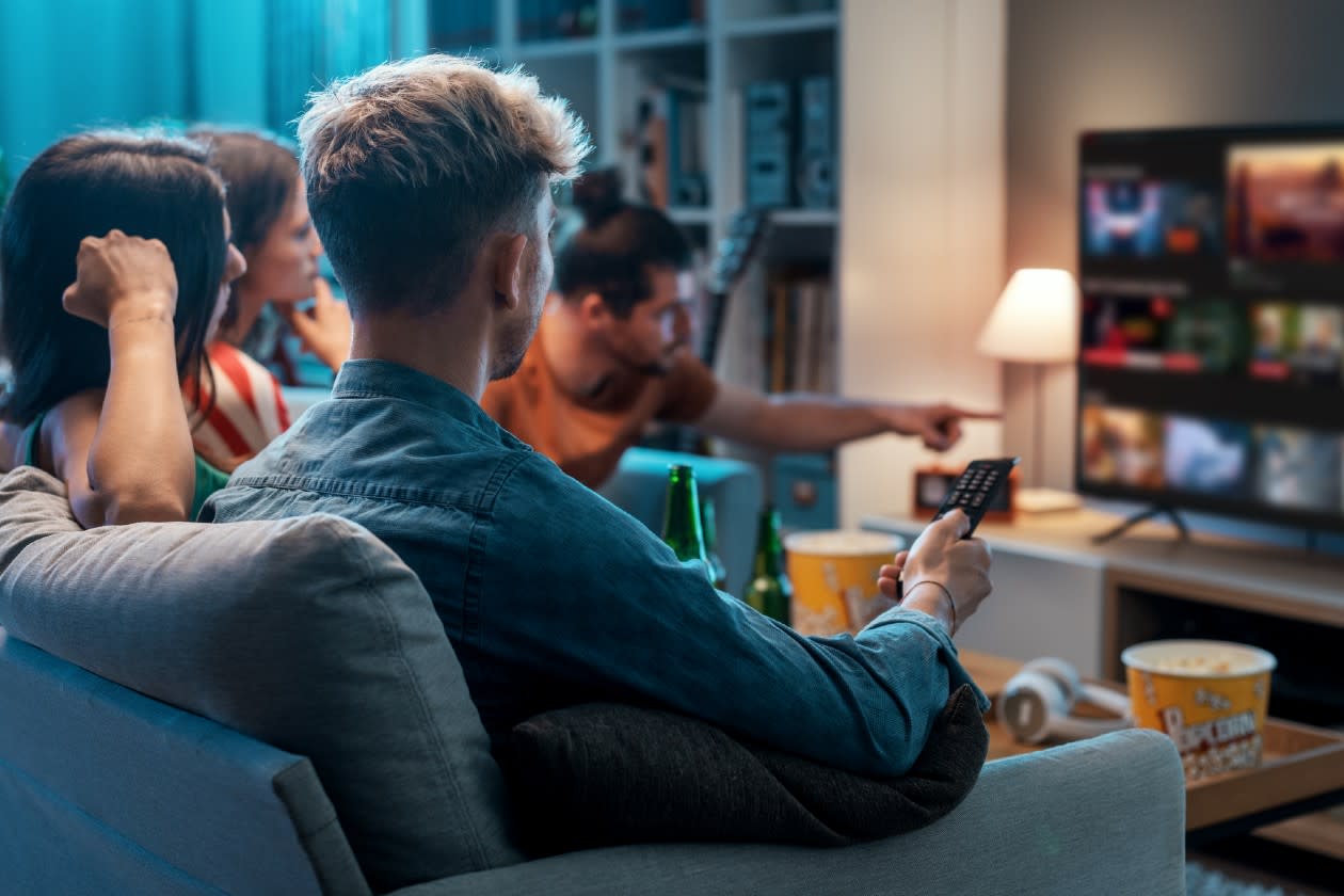 Group of friends streaming TV together on a sofa.jpg