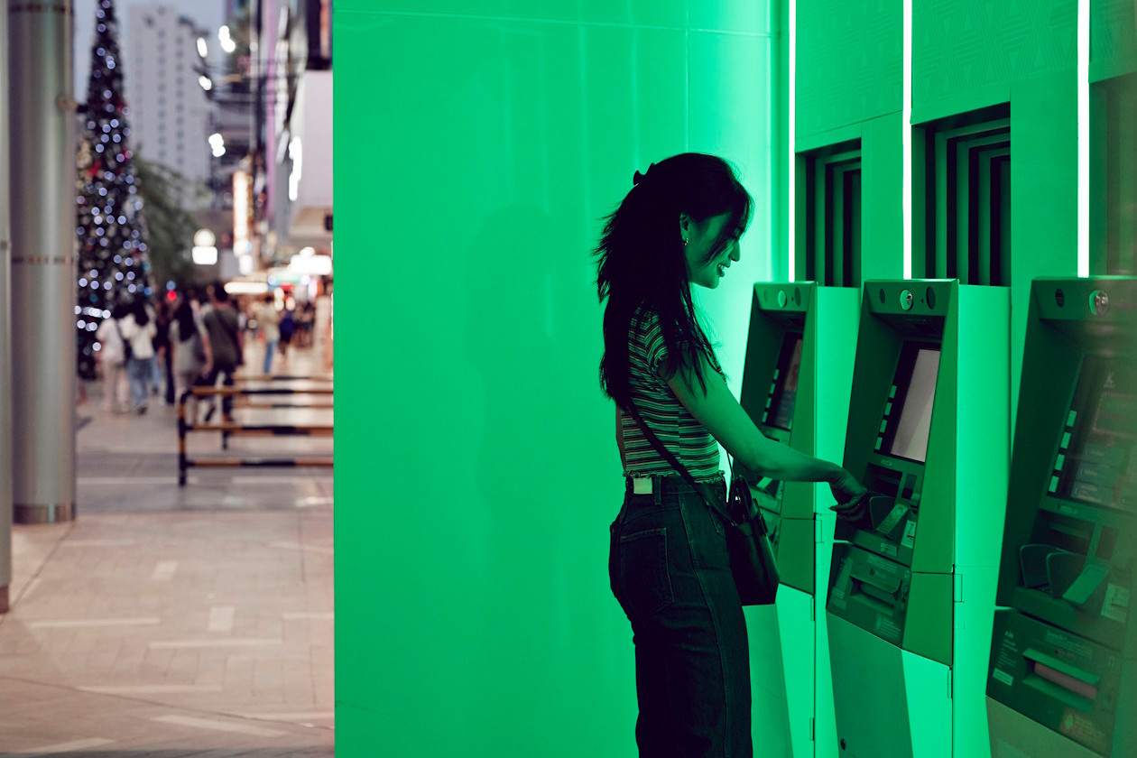 Lloyds - woman taking money out of ATM.jpg