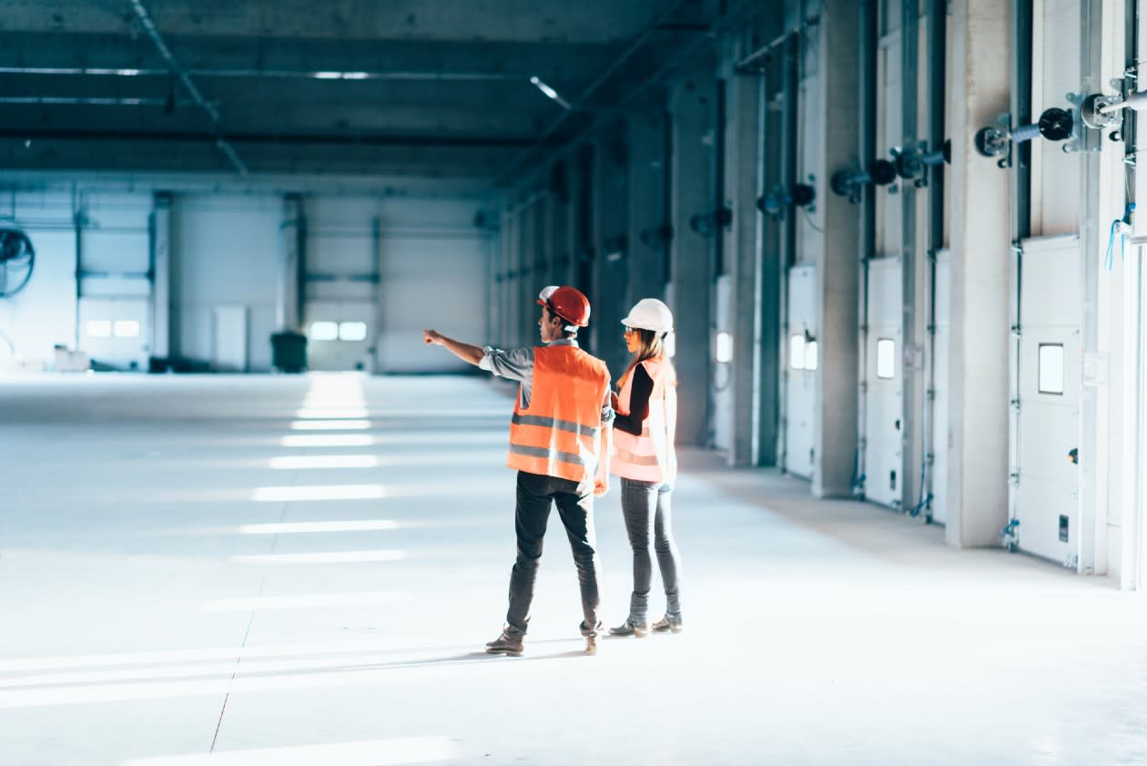 Two people inspecting a warehouse.jpg
