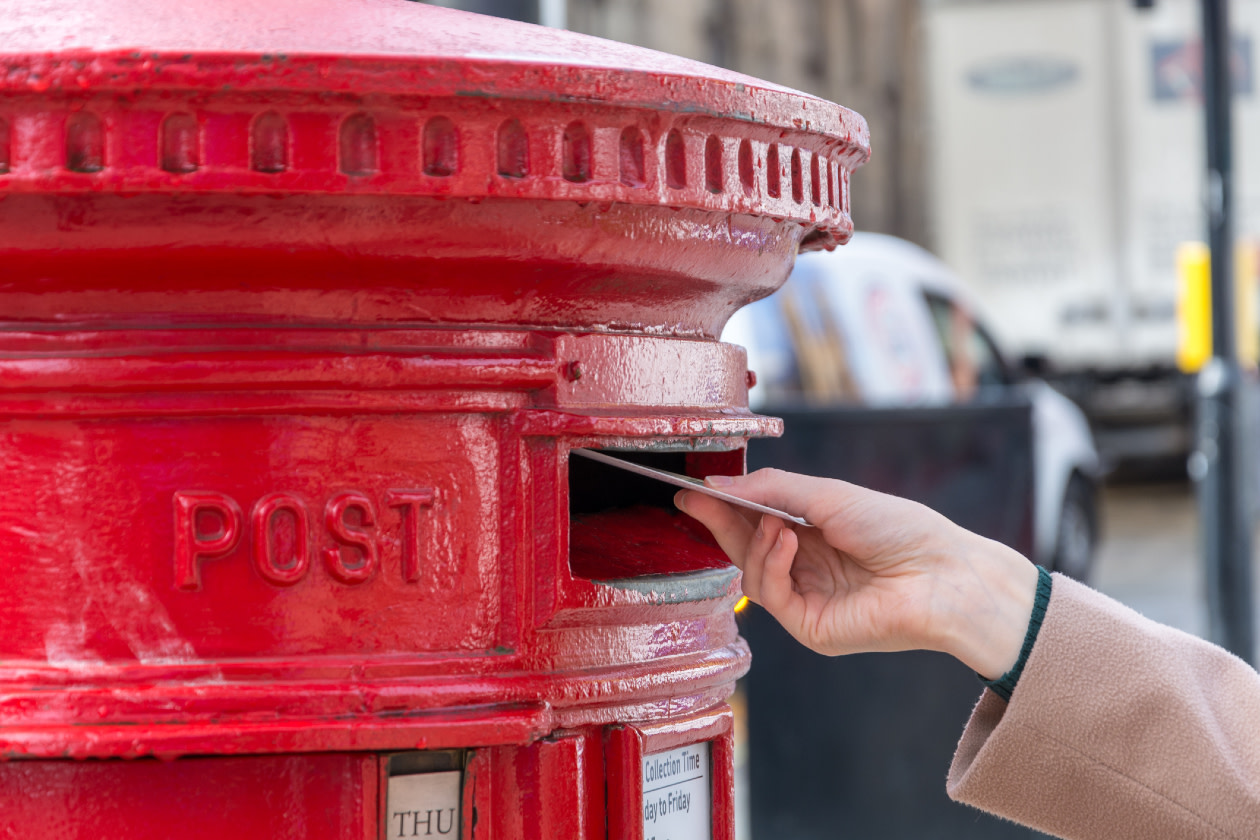 Red British post box from the side