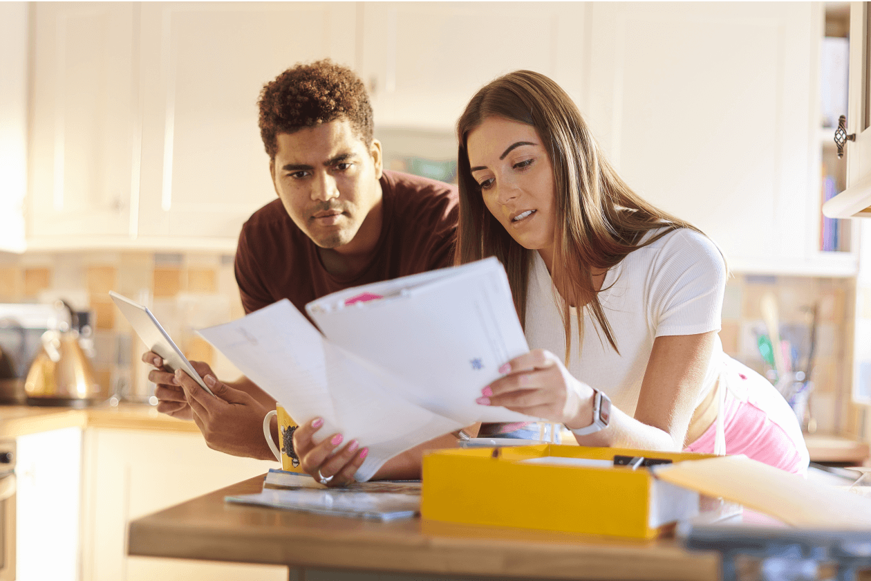 Young couple chatting about home finances