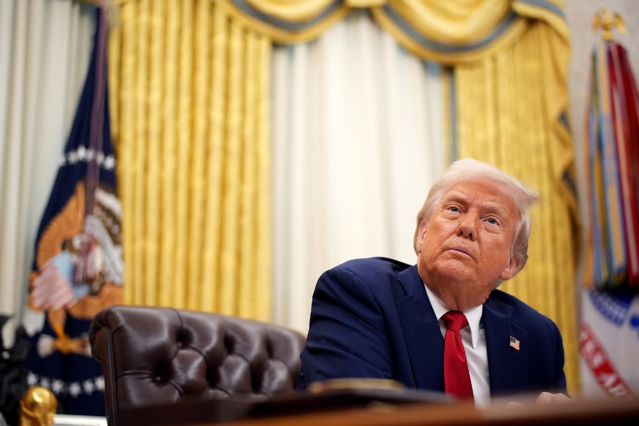 Donald Trump sat at his desk on the Oval Office.jpg