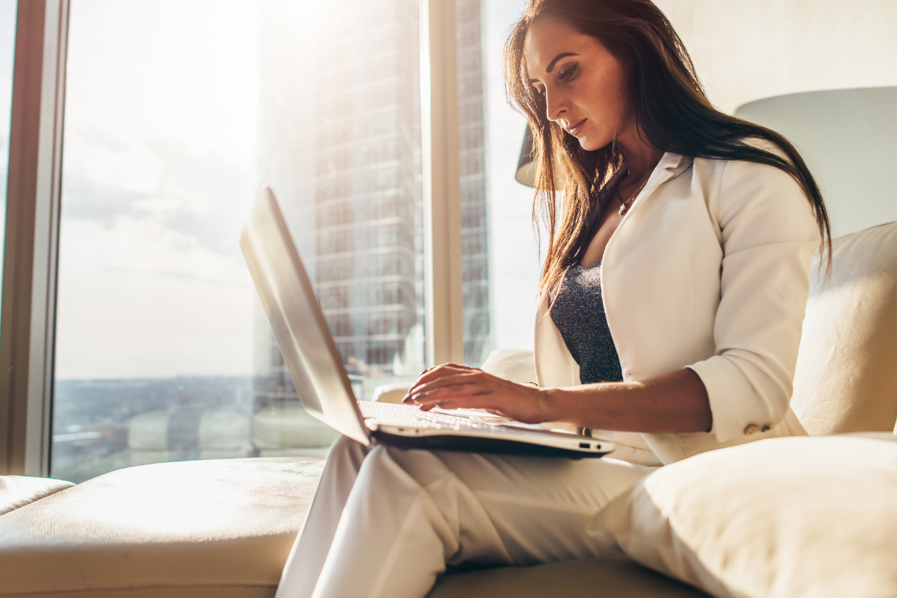 Young female professional working from her highrise apartment.png