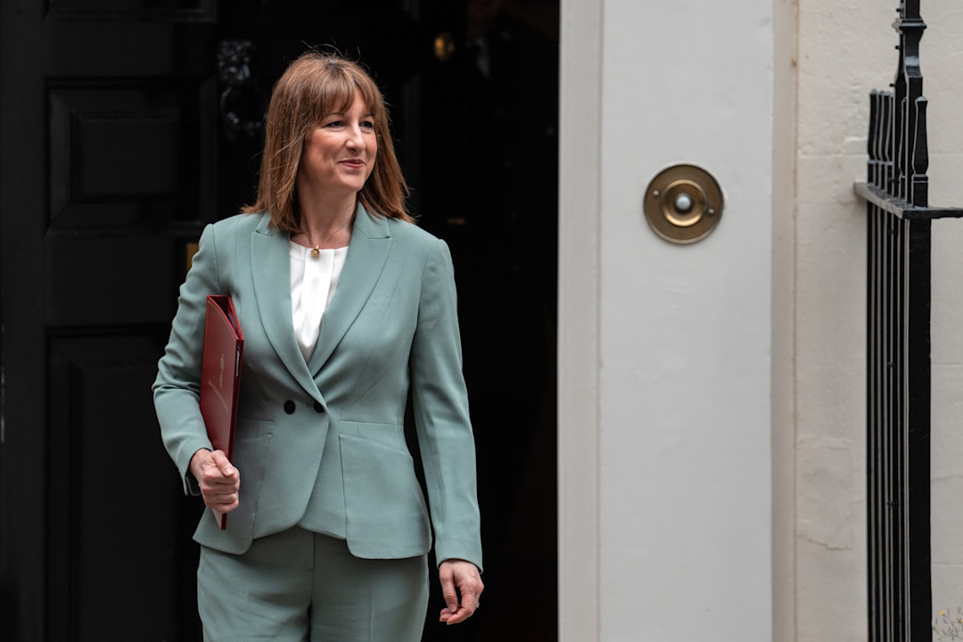 Rachel Reeves exiting downing street in green suit