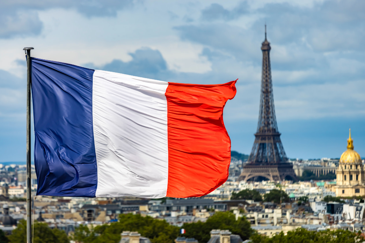 French flag with Eiffel Tower in the background.jpg