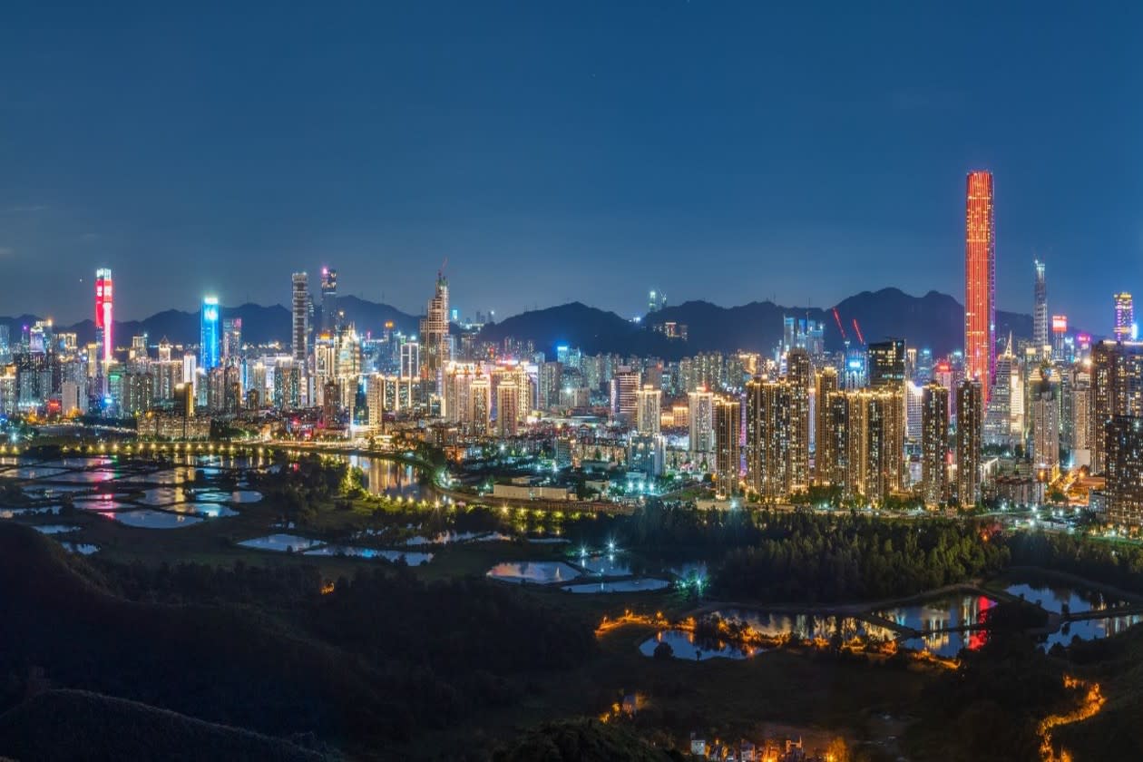 A city skyline in Asia with rice fields in foreground.jpg