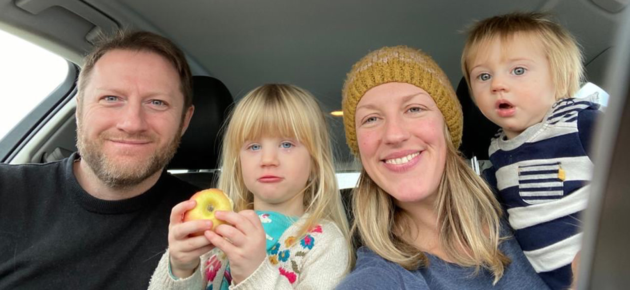 Tom and his family sat together in a car.jpg