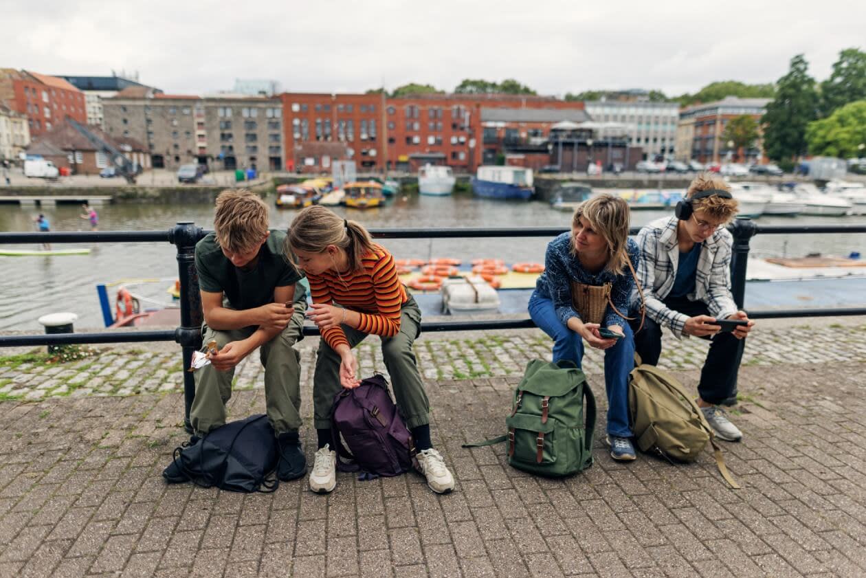 Mother and three children sat by the waterfront in Bristol.jpg