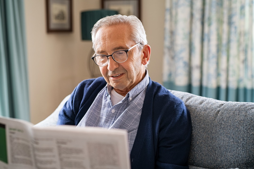 Older man reading newspaper.jpg