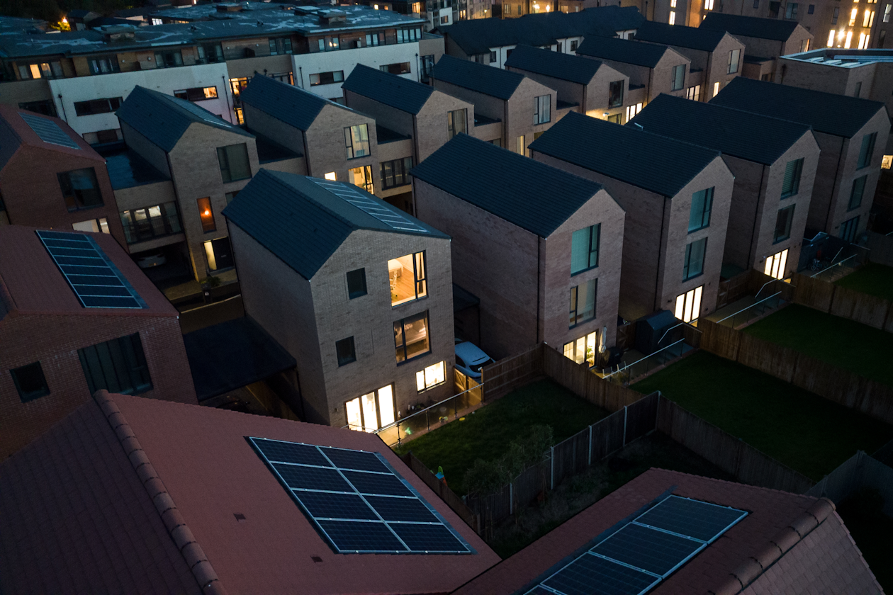 Houses at night lit up - Centrica