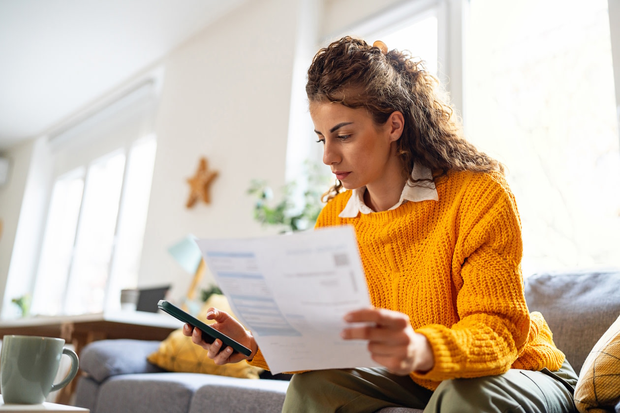Woman paying her taxes and bills.jpg