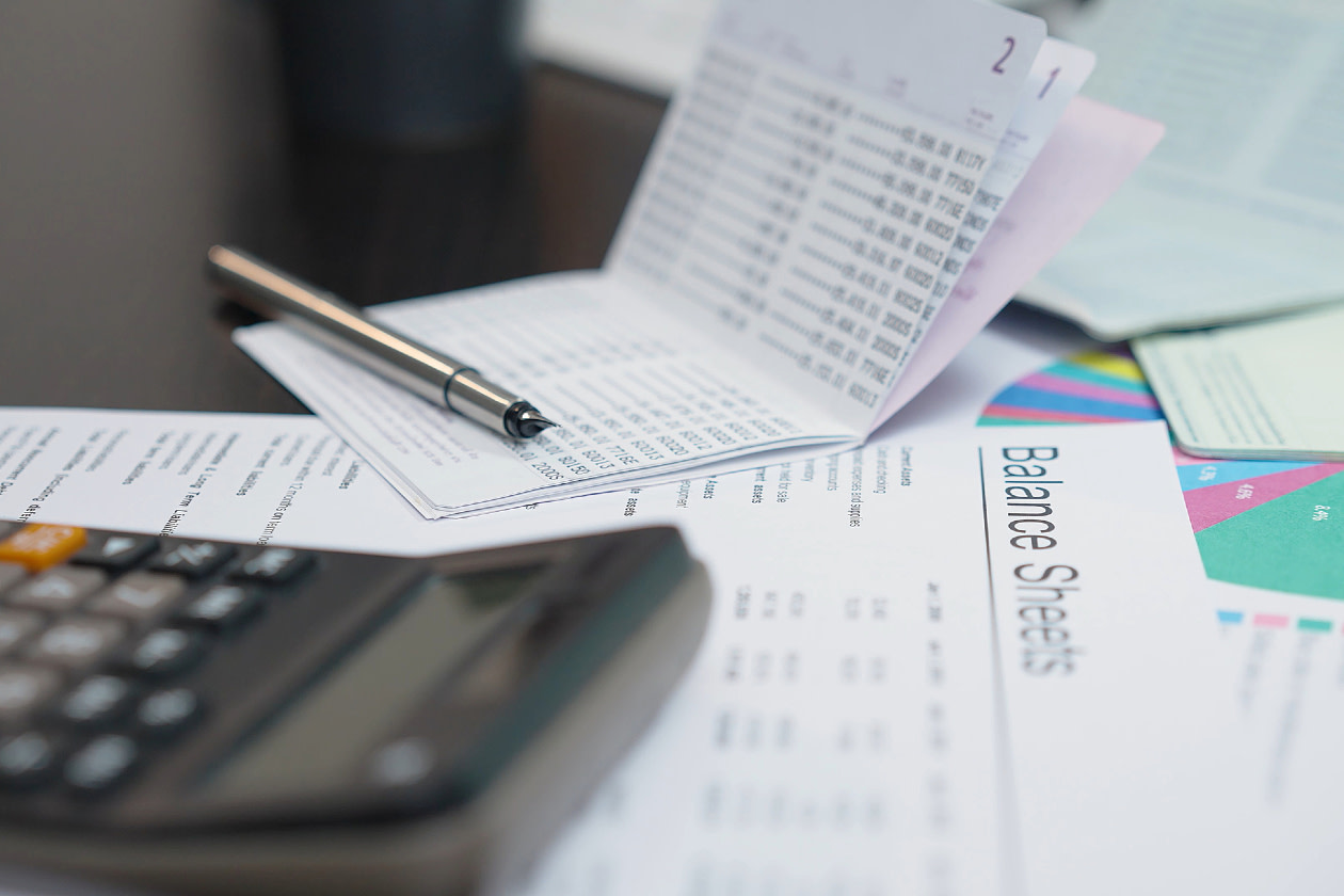 Balance sheet with calculator and pen.jpg