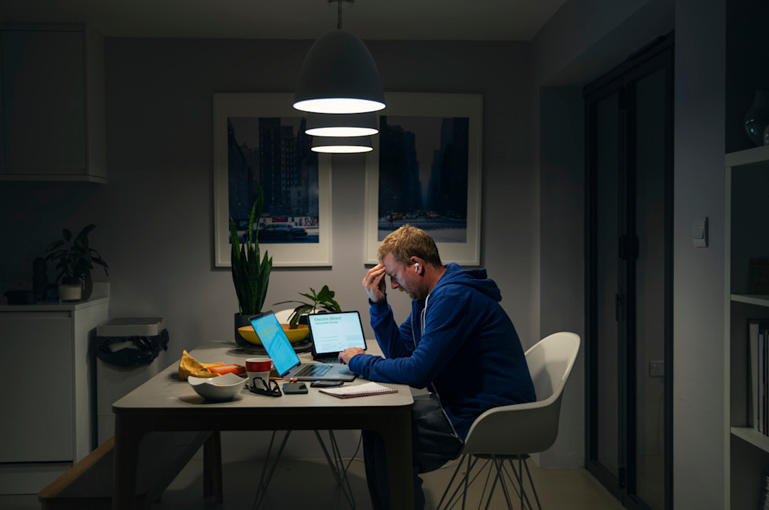 Man looking stressed at his computer.jpg