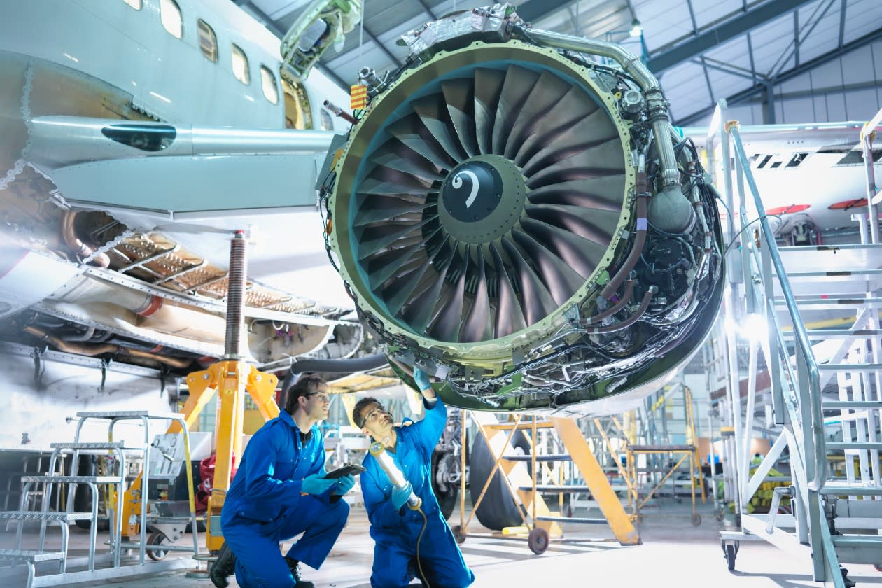 Rolls Royce - engineers inspect a plan engine.jpg