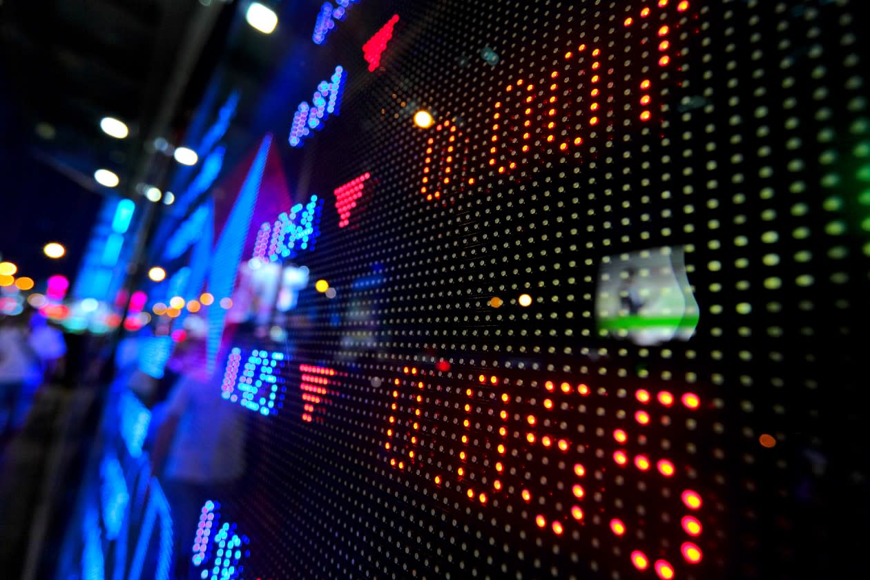 Red arrows on a negative stock market display board.jpg