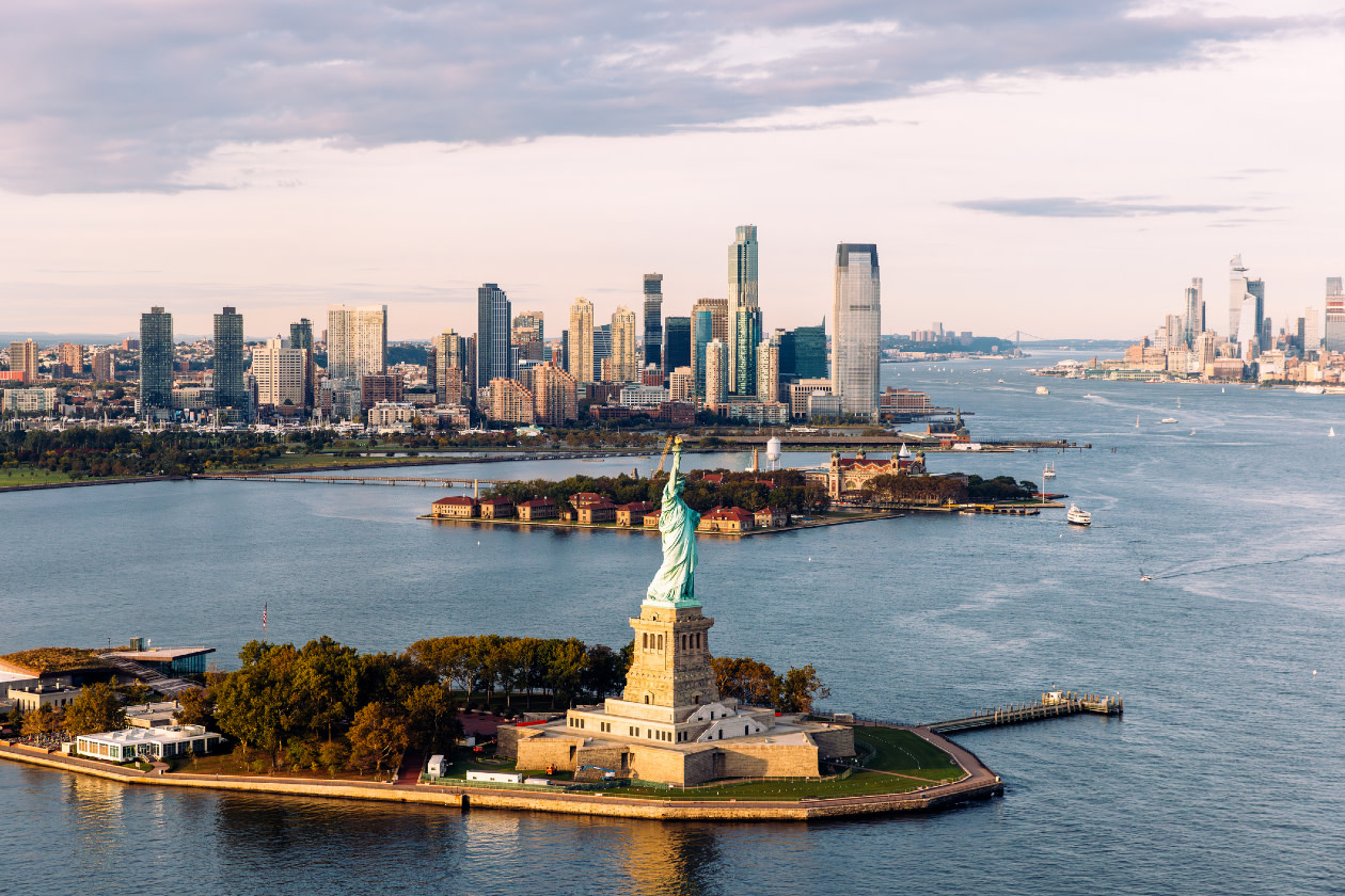 Statue of Liberty and Jersey City skyline seen from helicopter, New York City, USA.jpg
