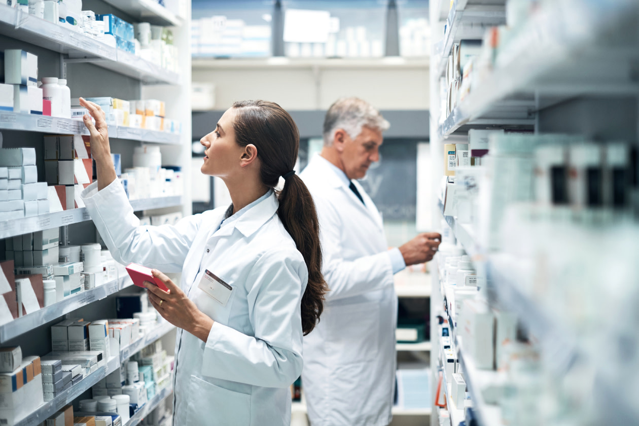 Two pharmacists checking products while working together in a dispensary.jpg