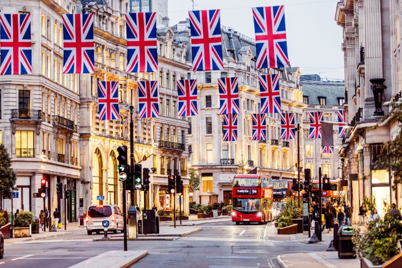 Banners of 5 seperate UK flags draped across roofs on Regent Street London.jpg