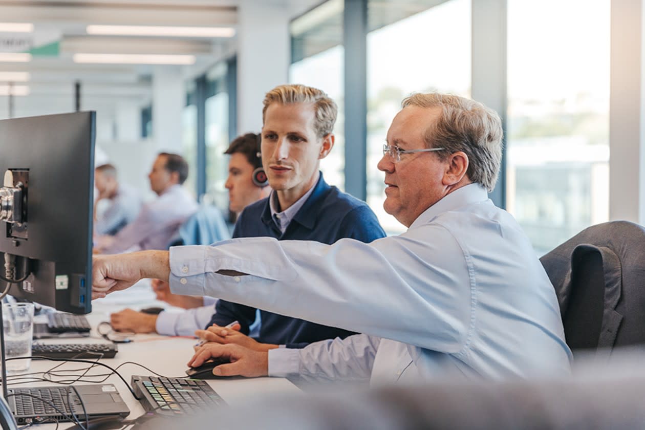 HL Select fund managers having a conversation at their desks.jpg
