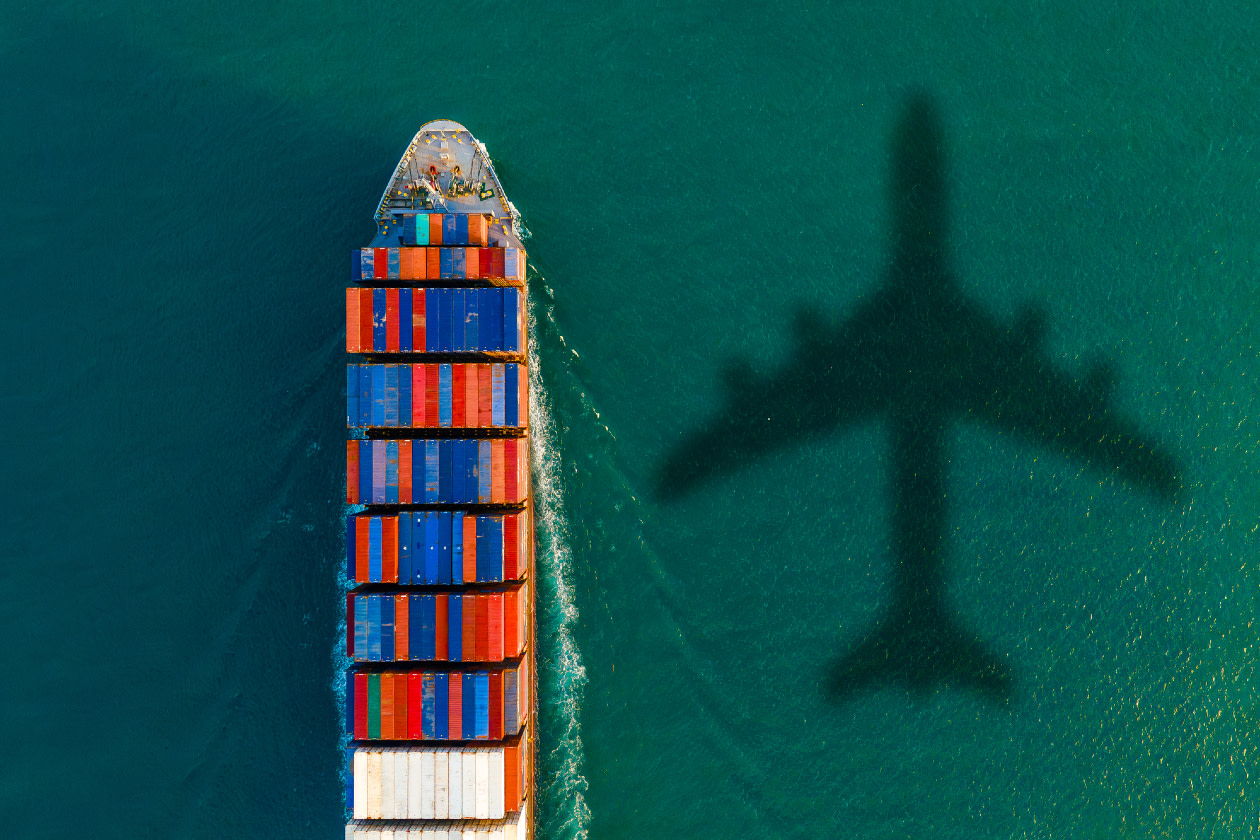 Aerial view of a cargo ship in a thriving harbor- GettyImages