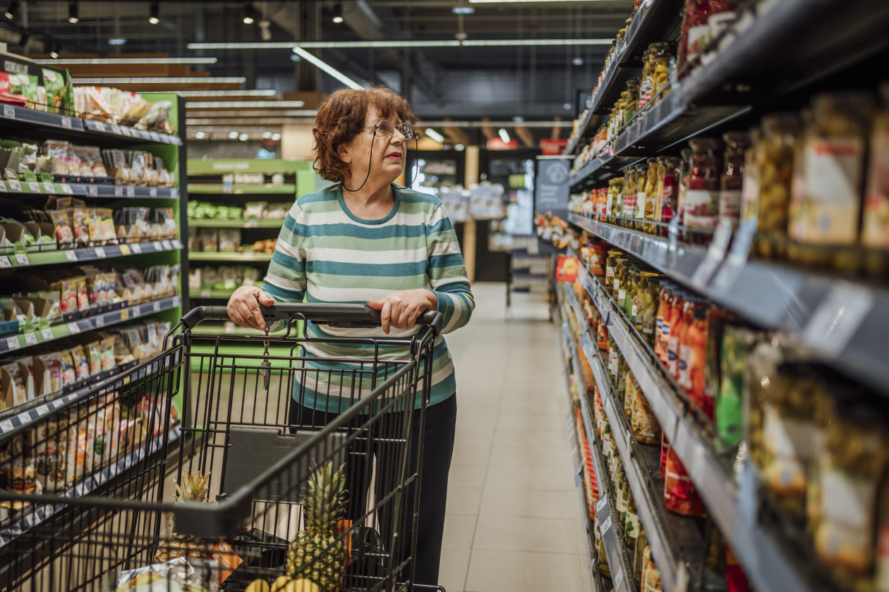 Senior lady browsing the supermarket.png