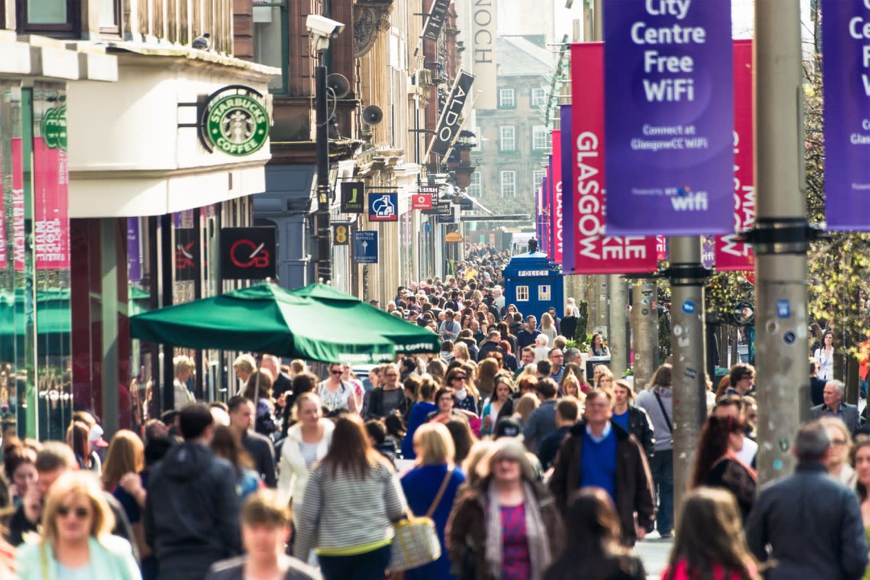 A busy pedestrian shopping street in Glasgow Scotland.jpg