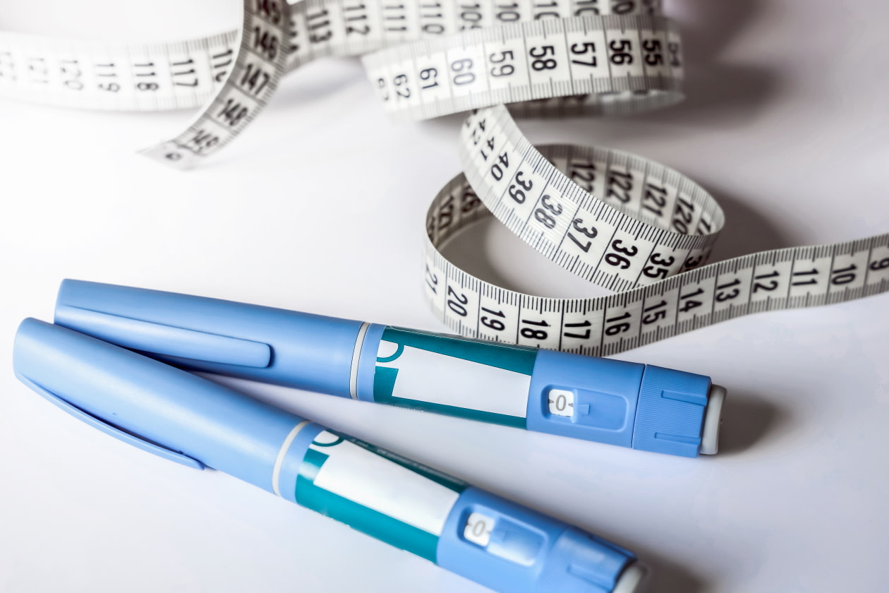 Image of weight loss drug syringe and tape measure.jpg