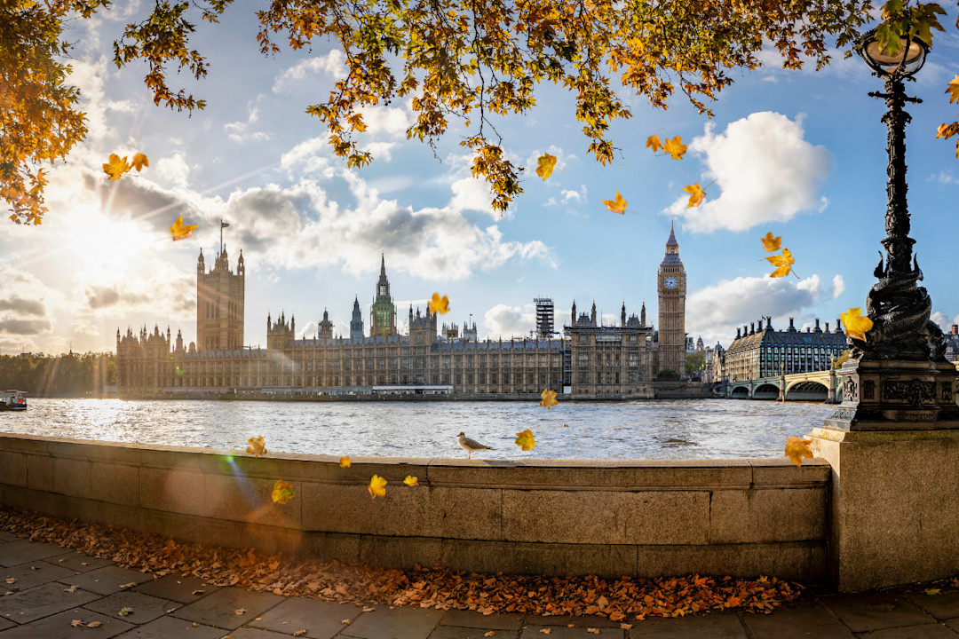 Panoramic view to Westminster Palace and Big Ben tower in London, UK, during golden autumn time 