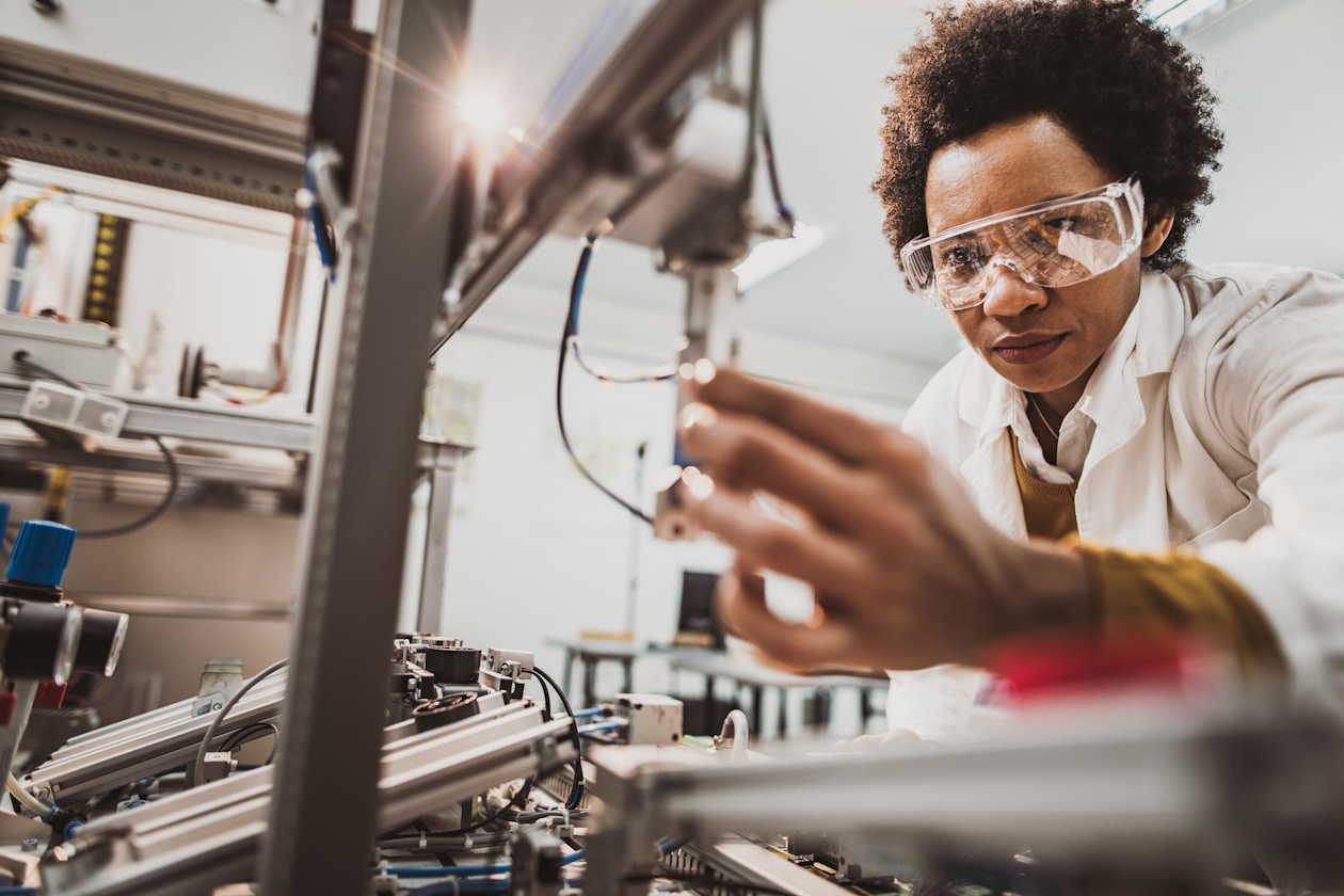 Engineer work on industrial machine in laboratory