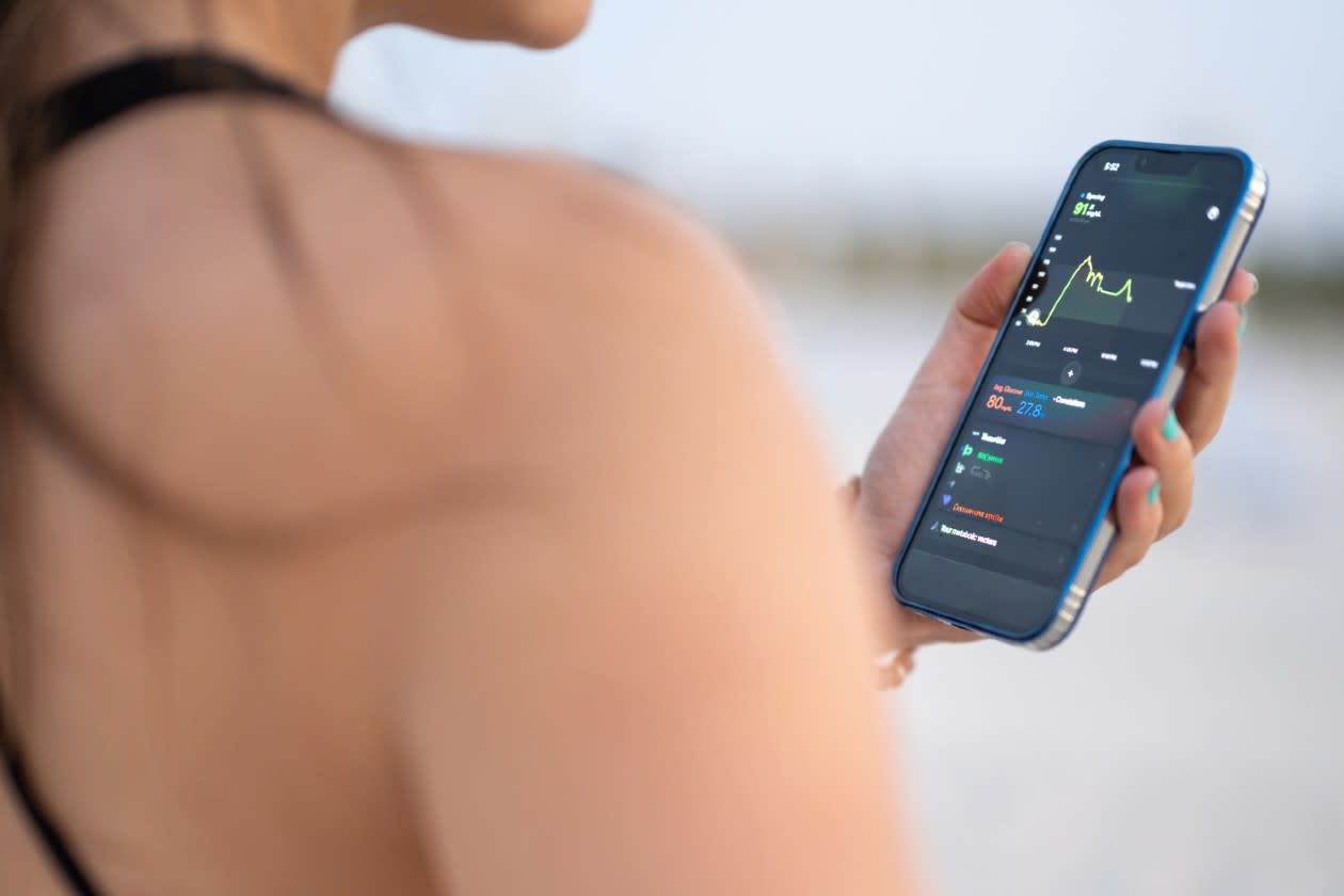 Female runner checking a chart on her phone.jpg