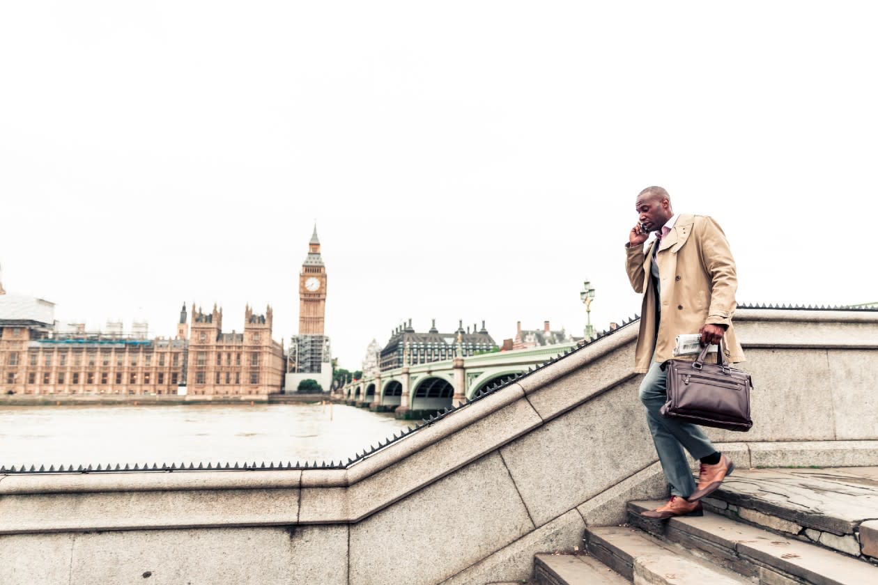 Businessman walking down steps along the Thames with Big Ben in view.jpg