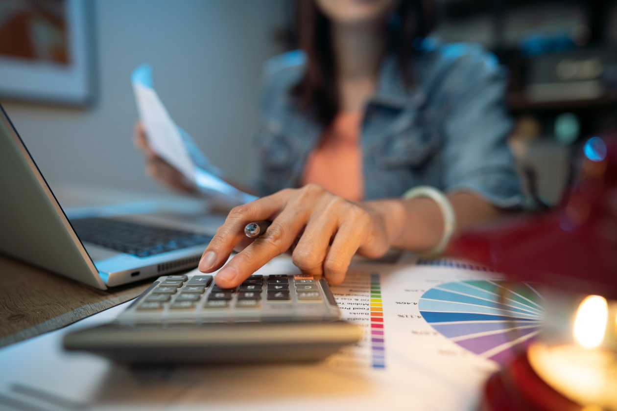 Woman working on her finances with a calculator.jpg