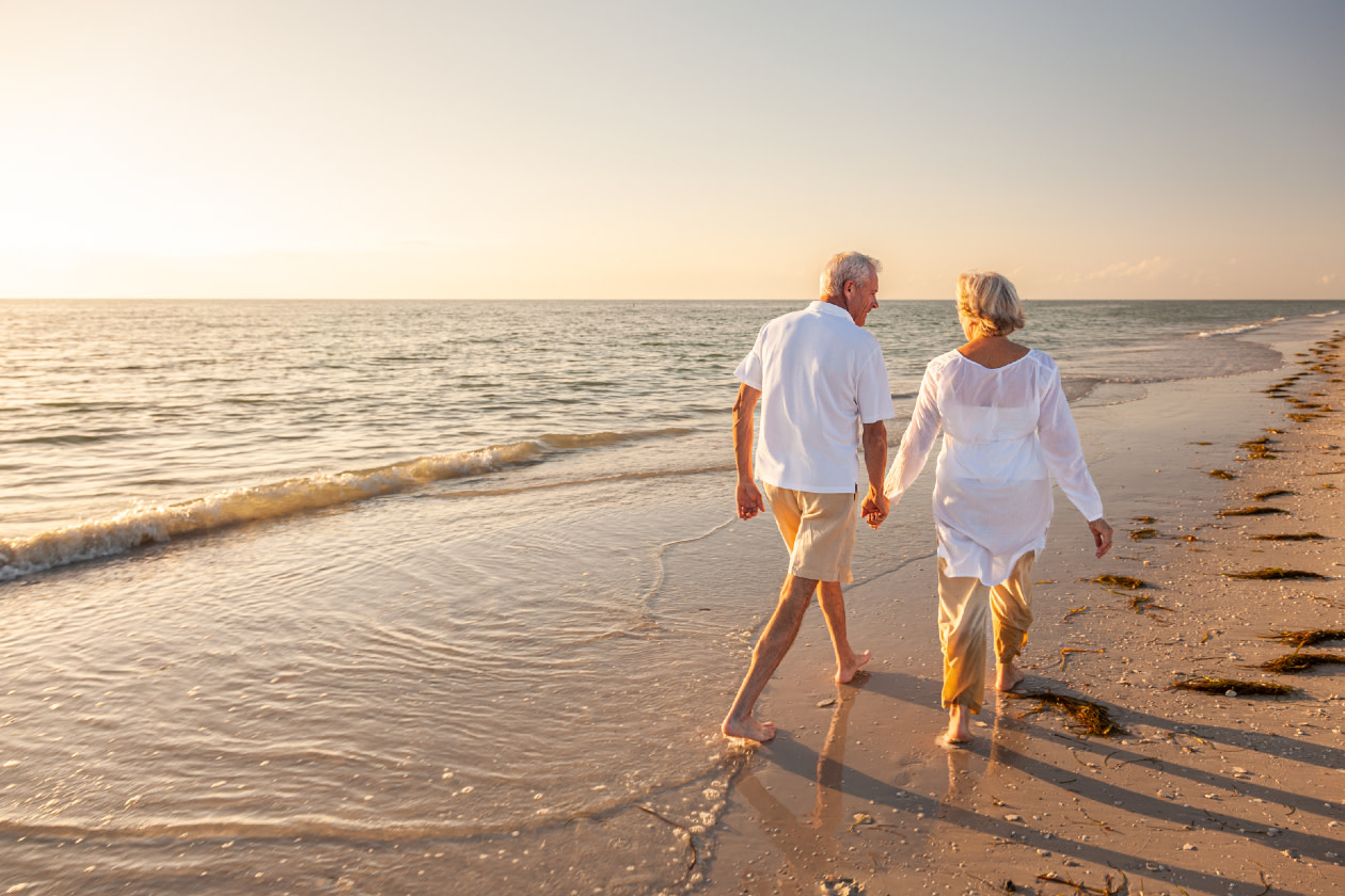 Old couple holding hands - GettyImages