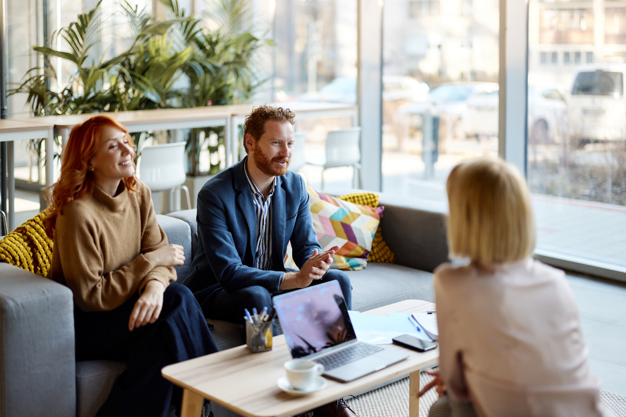 A couple having a meeting with adviser in the office.jpg