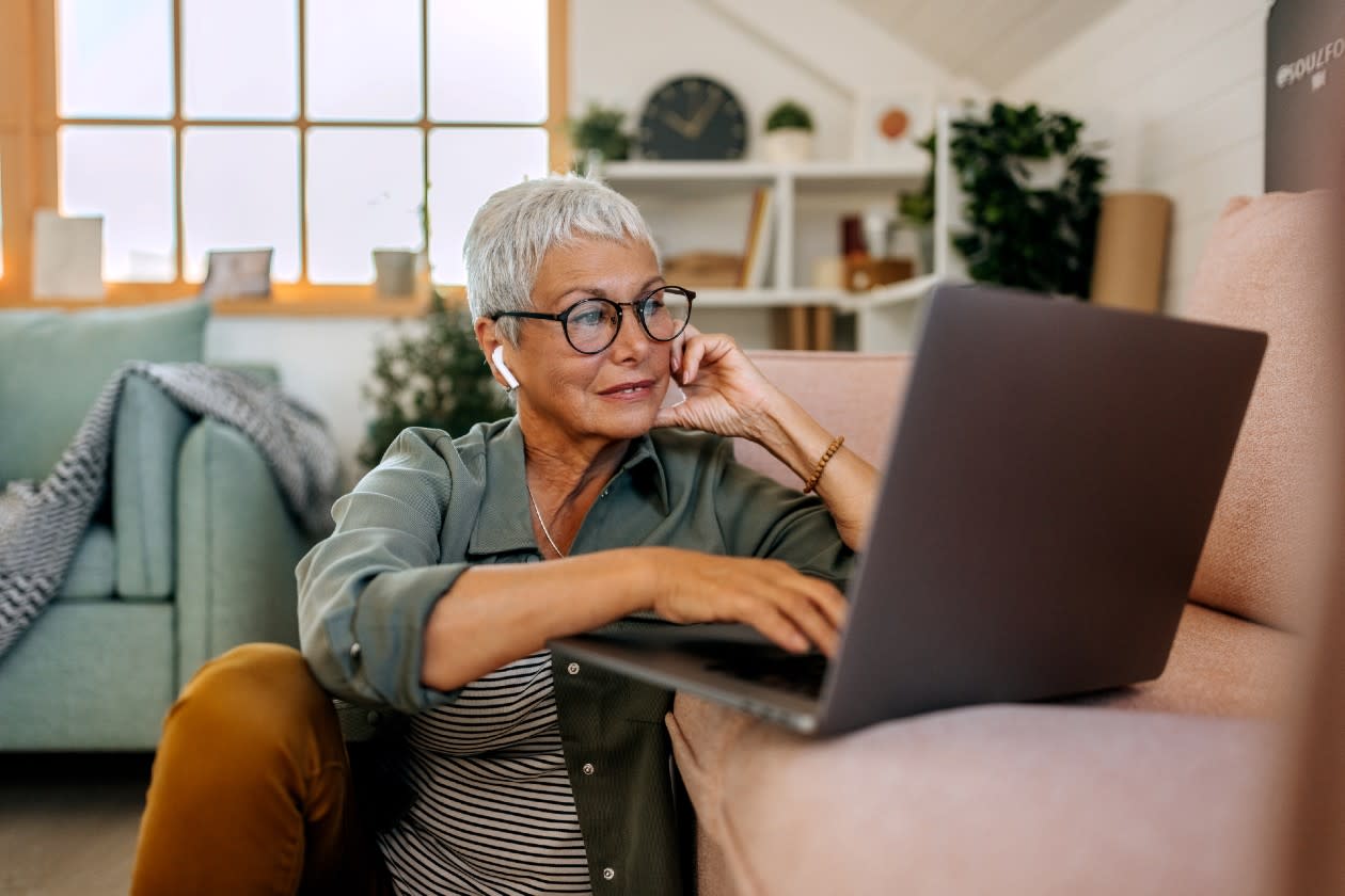 Female pension investor using her laptop in a living room.jpg