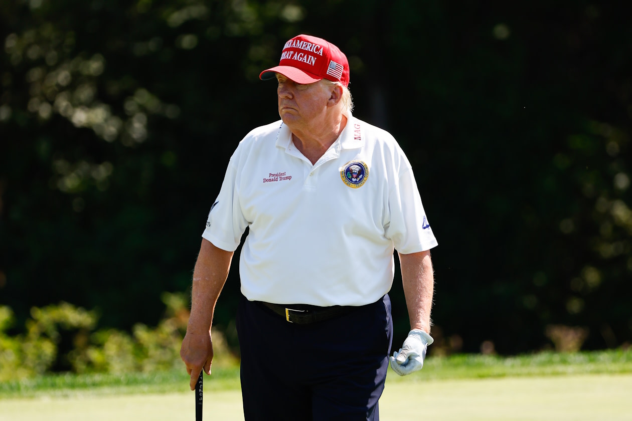 Trump wearing MAGA hat on the golf course.jpg