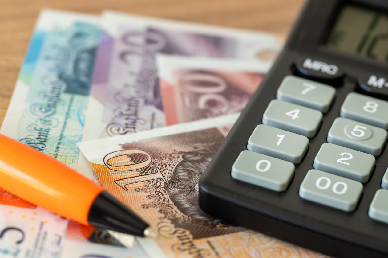 British pounds, calculator and money file concept
