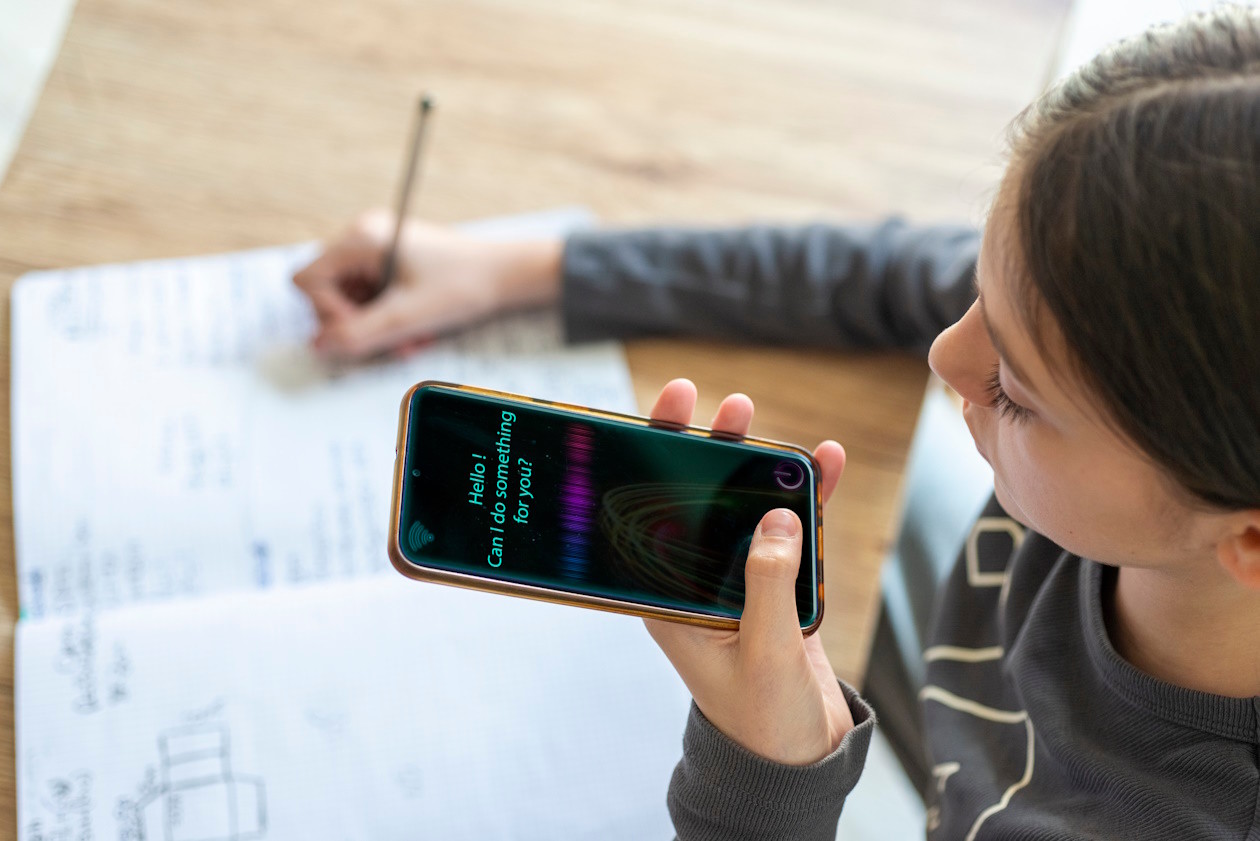 Girl using AI to help with her homework.jpg