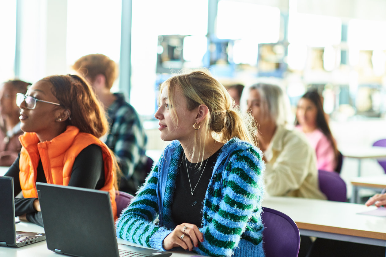Female student listening in class at technical college