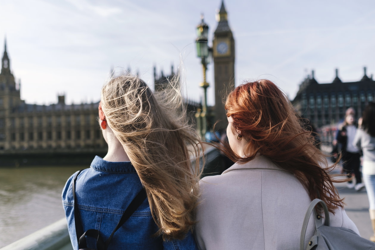 Two women standing in front of houses of parliment.jpg