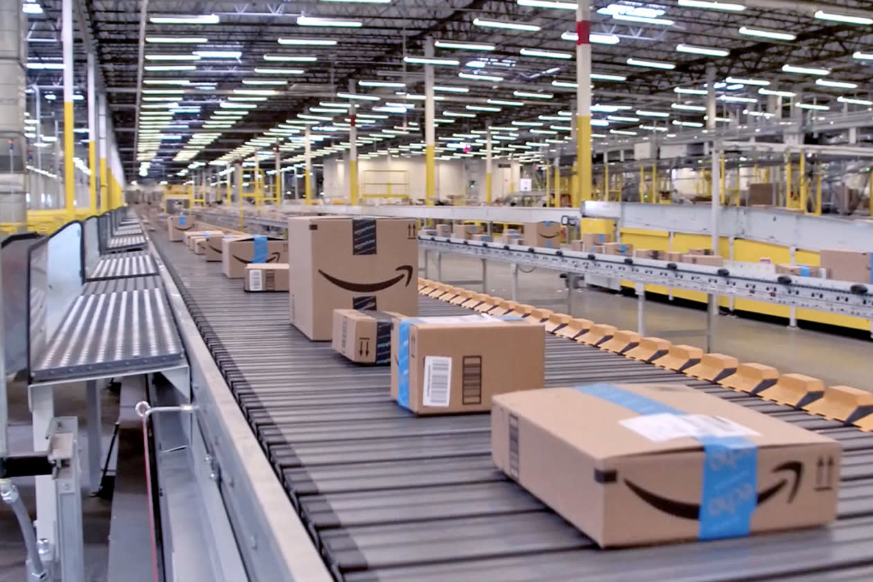 Amazon- shares rise but profits fall 