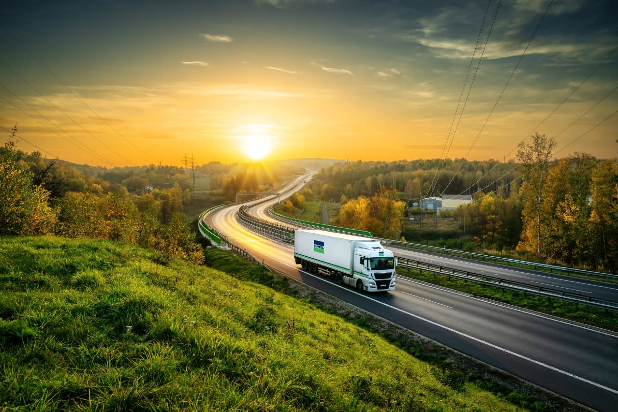 A bunzl lorry on the road at sunset - credit bunzl plc