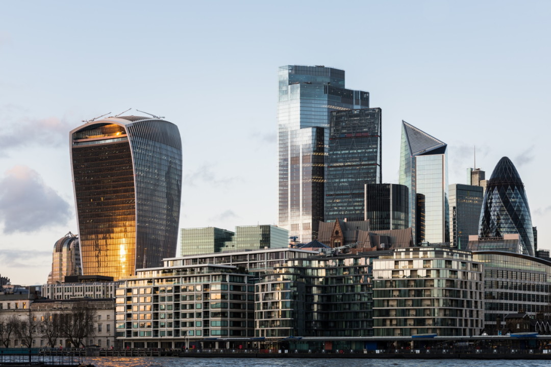 View of The City of London-s Illuminated Financial District Skyline at Dusk.jpg