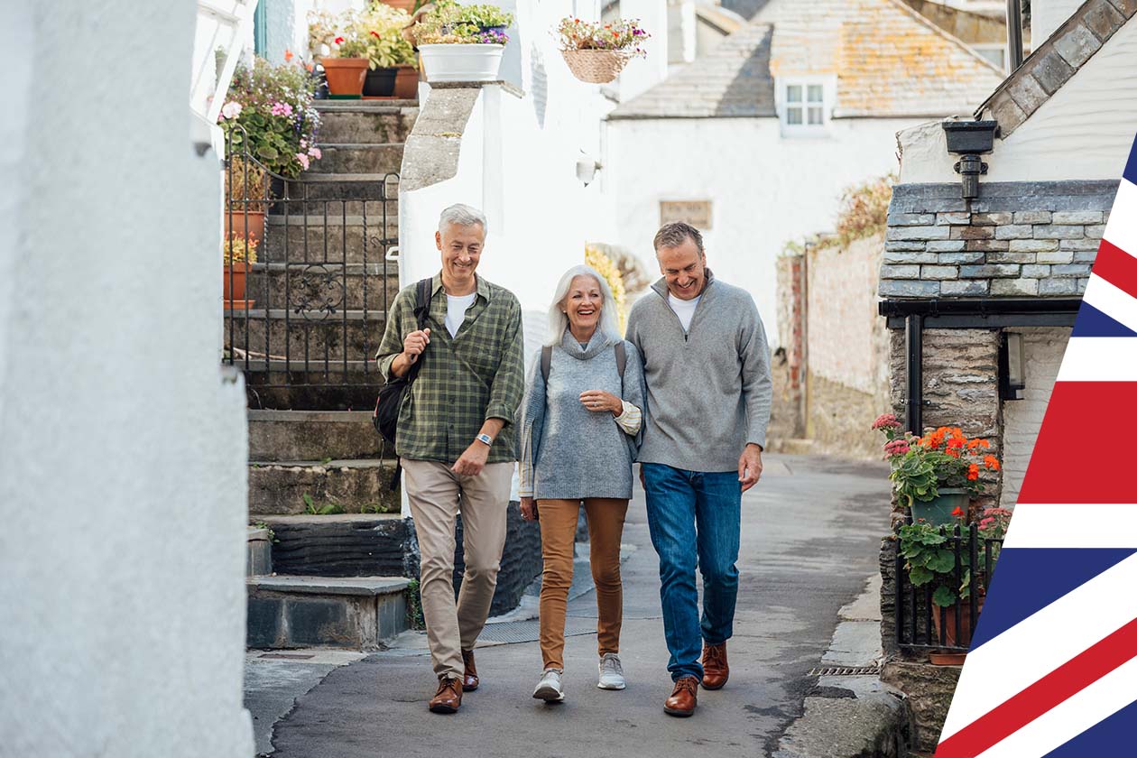 A group of male and female friends walking through a cobbled street.jpg