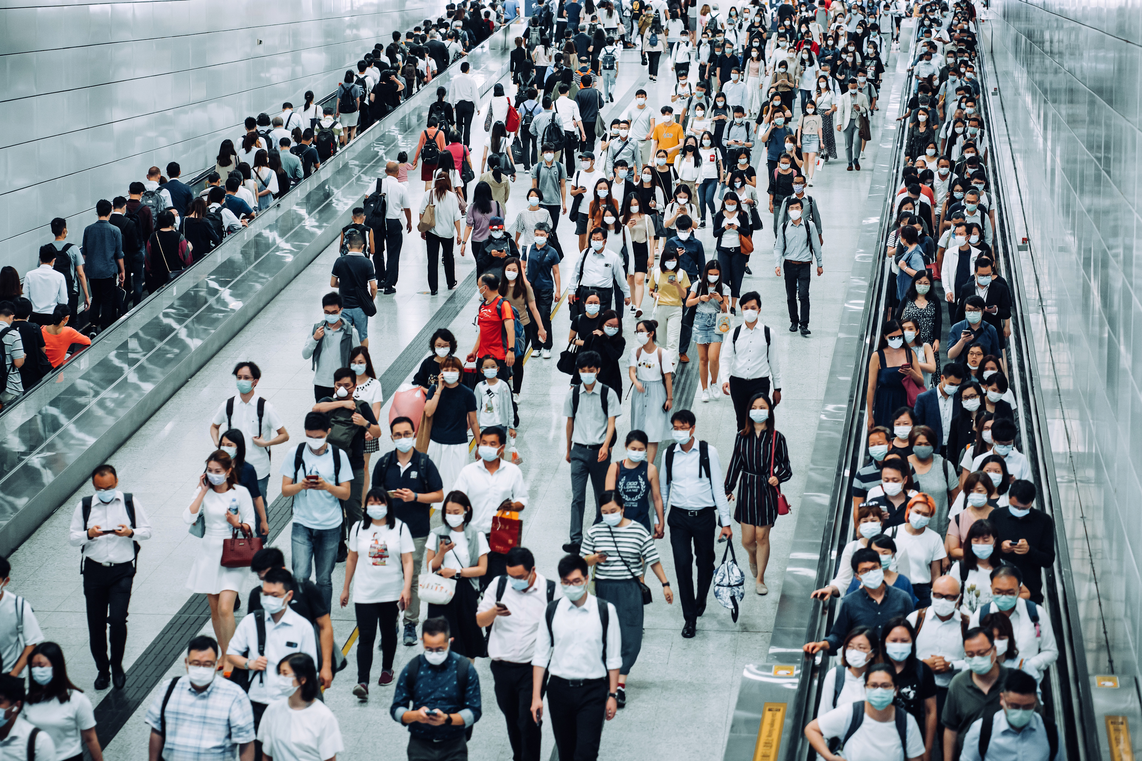 Crowd of people wearing covid face masks.jpg